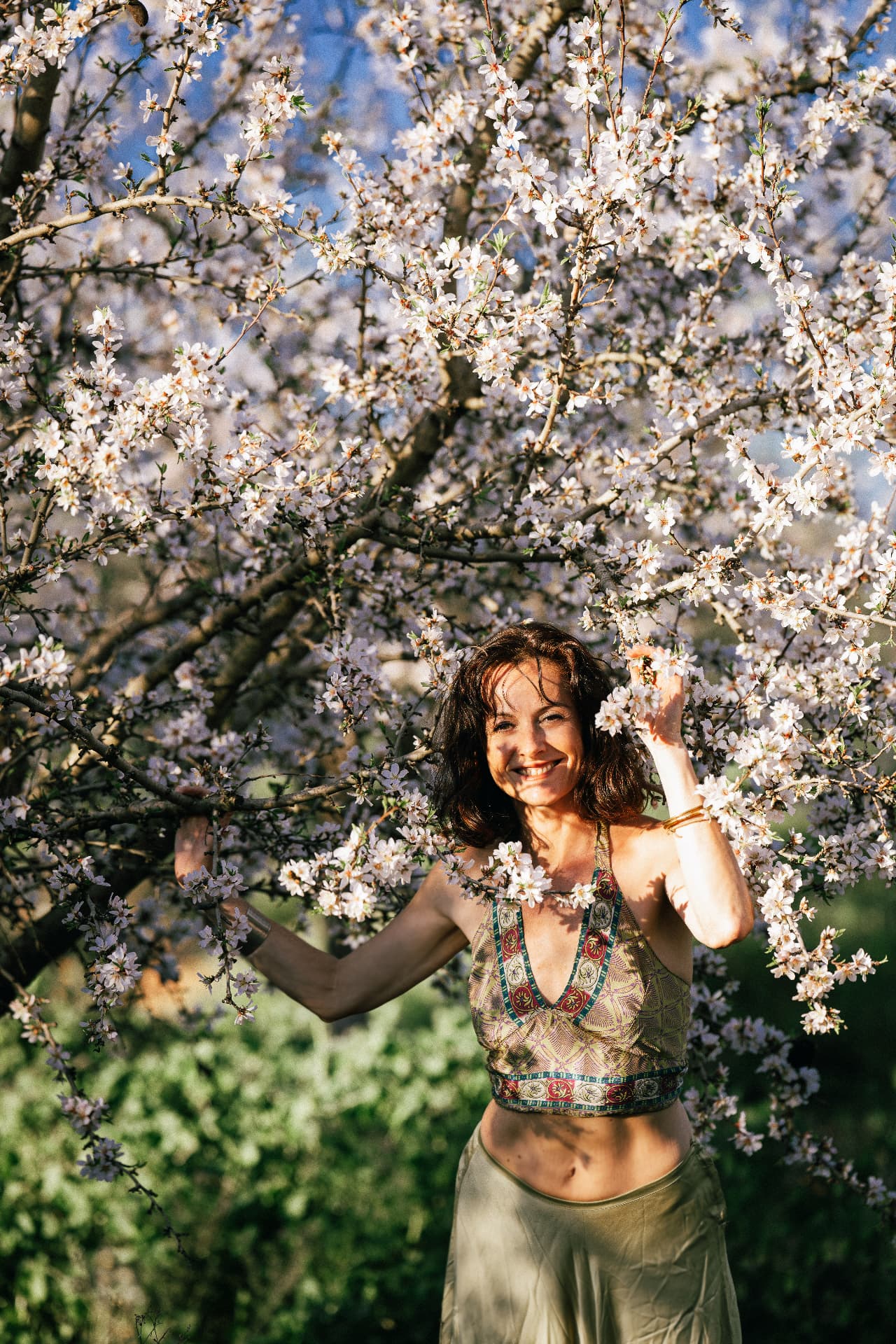 Saskia Griffiths among almond blossom